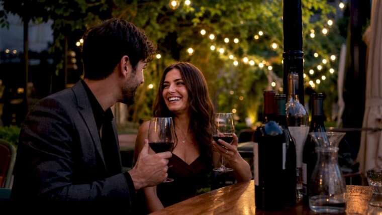 Couple tasting wine at vineyard tasting room