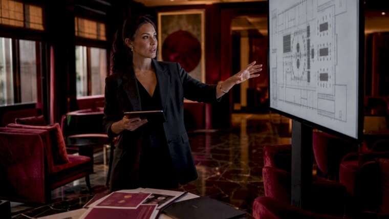 Female event planner reviewing venue layout
