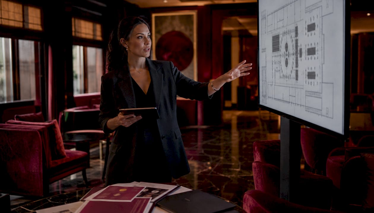 Female event planner reviewing venue layout