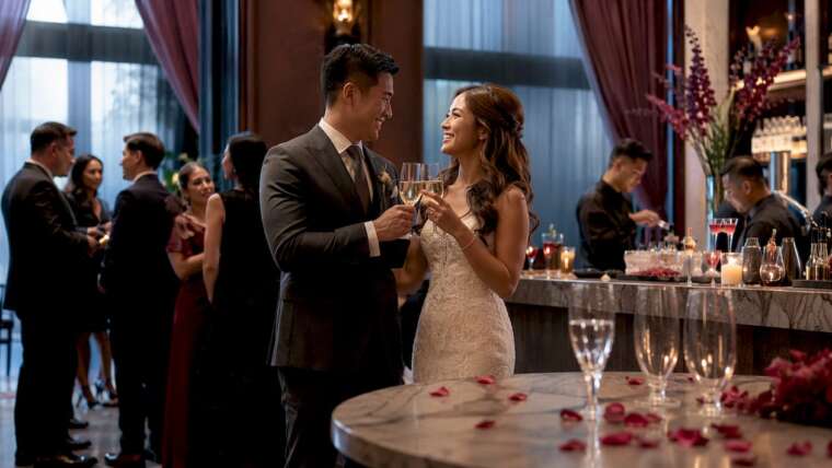 Bride and groom toasting at wedding open bar