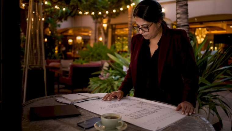 Event coordinator reviewing bar floorplan