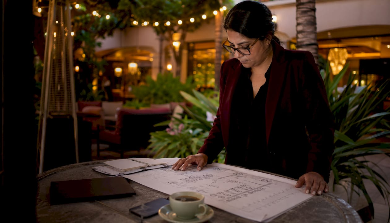 Event coordinator reviewing bar floorplan