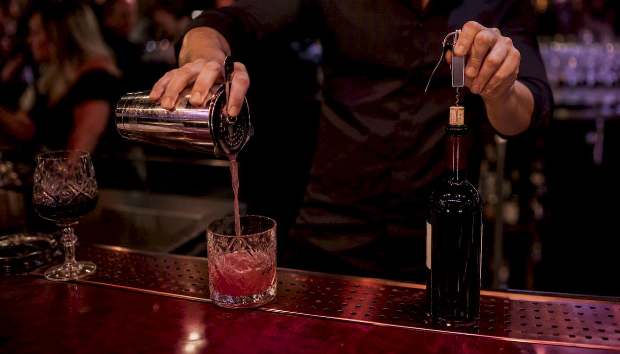 Bartender hands pouring beer and wine