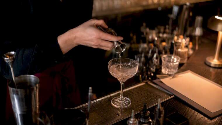 Bartender pouring allergy-friendly cocktail