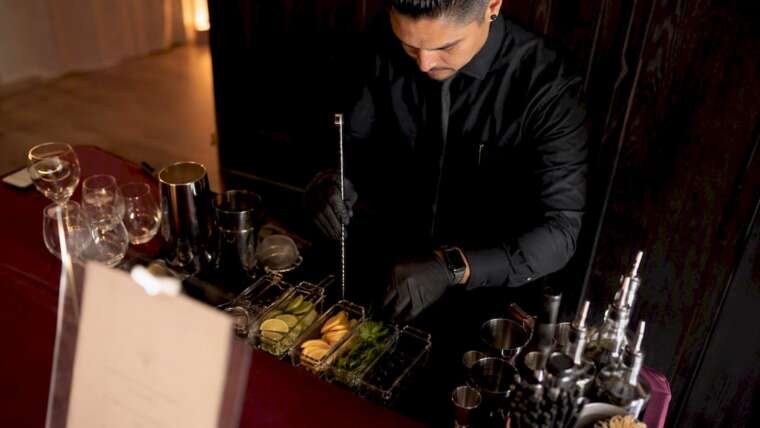 Bartender setting up mobile bar at event