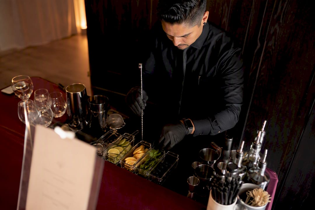 Bartender setting up mobile bar at event