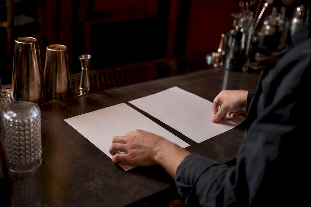 Bartender hands comparing bartending quotes