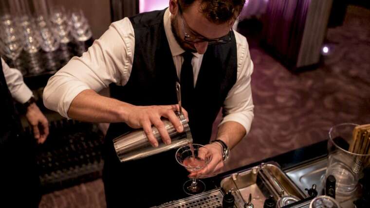 Bartender pouring cocktail at VIP bar in Las Vegas