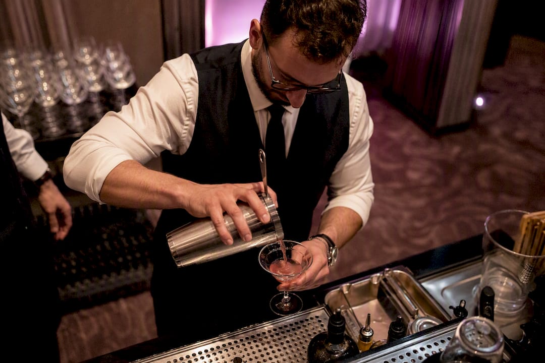 Bartender pouring cocktail at VIP bar in Las Vegas