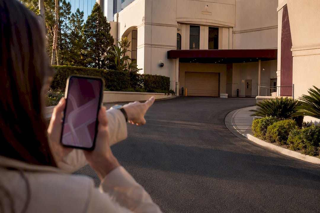 Phone photographing an event loading entrance
