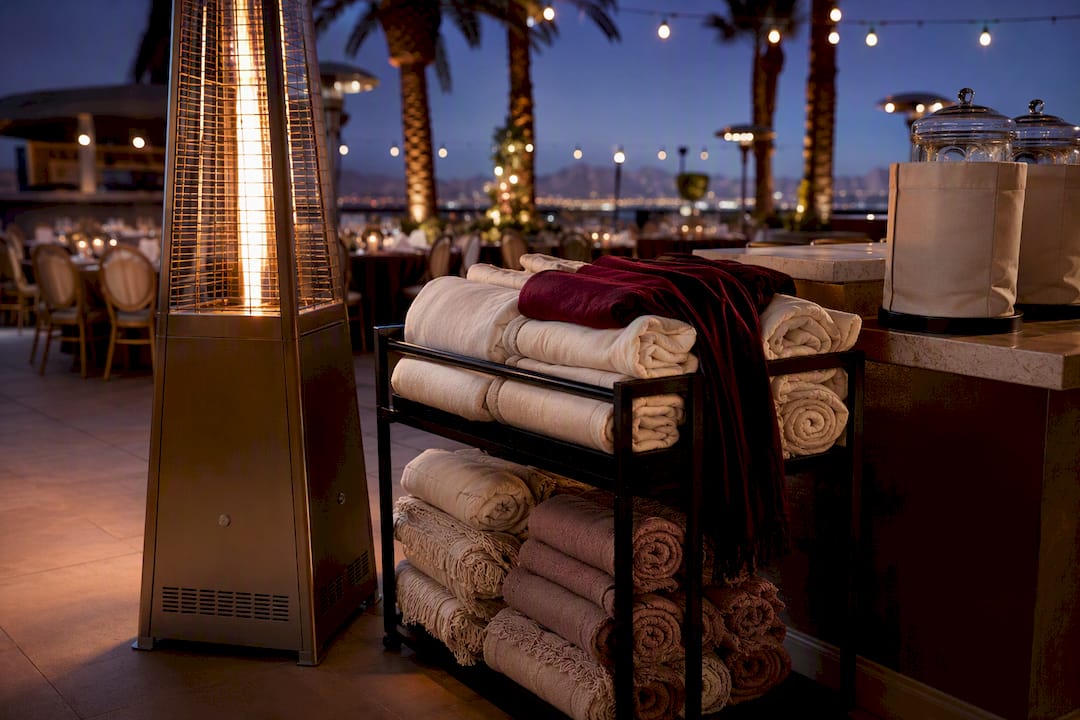 Patio heater and blankets at winter wedding