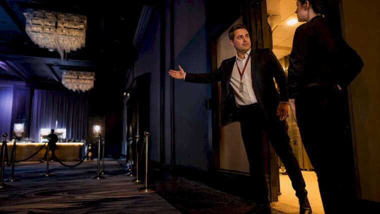 Coordinator and bartender reviewing venue access