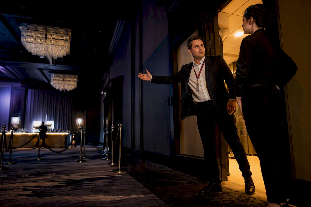 Coordinator and bartender reviewing venue access