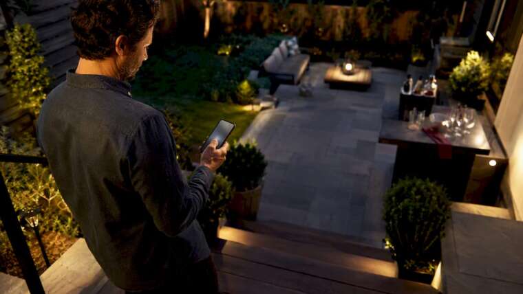 Host reviewing backyard event arrangements