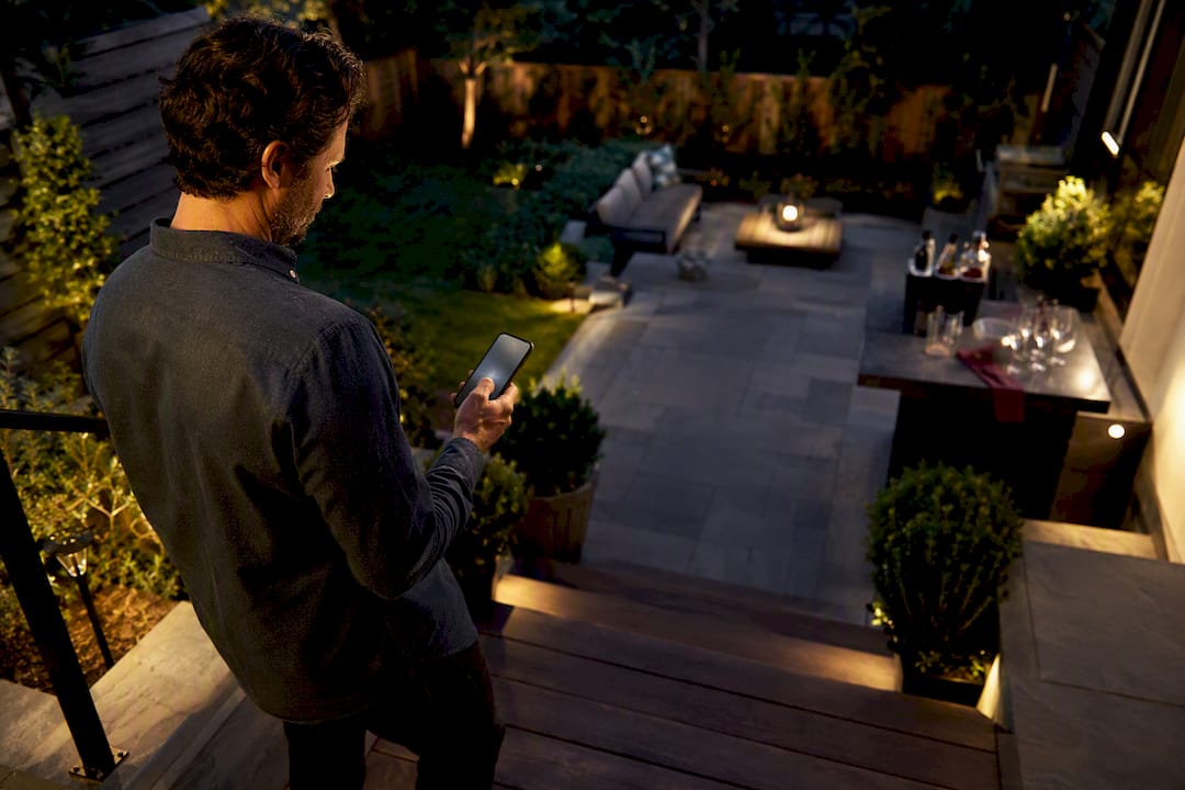 Host reviewing backyard event arrangements