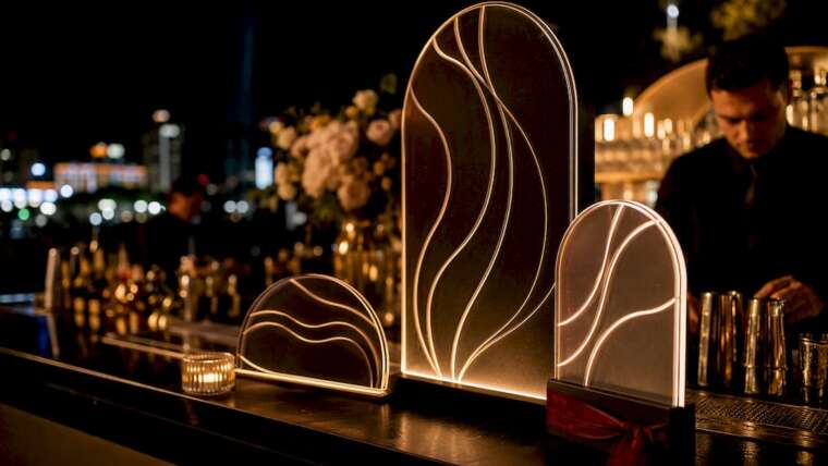Elegant signage beside a wedding bar