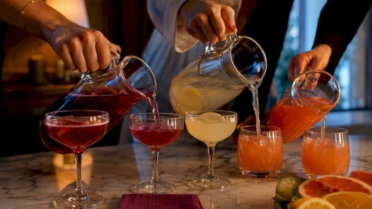 Batch cocktails poured for a party