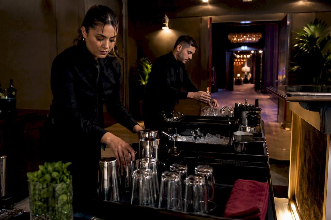 Bartenders preparing an event bar station