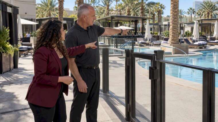 Event planners reviewing pool alcohol service area