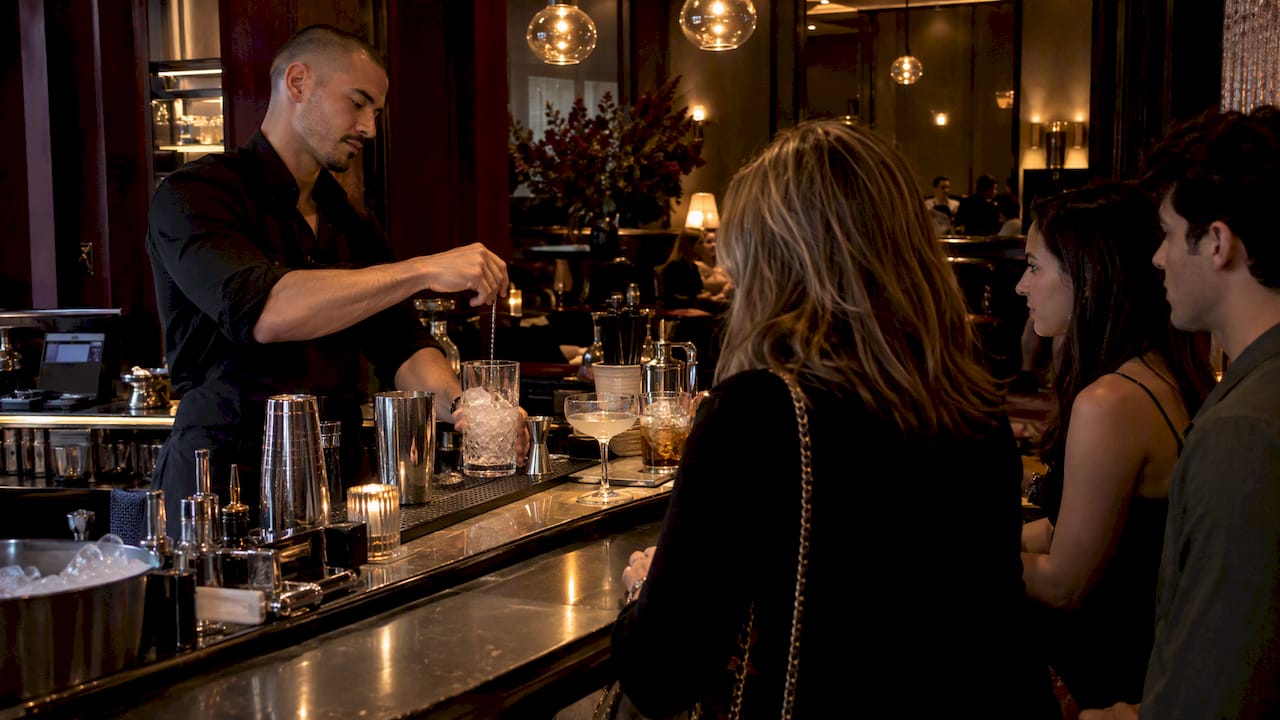 Guest bartender demonstrating cocktail technique